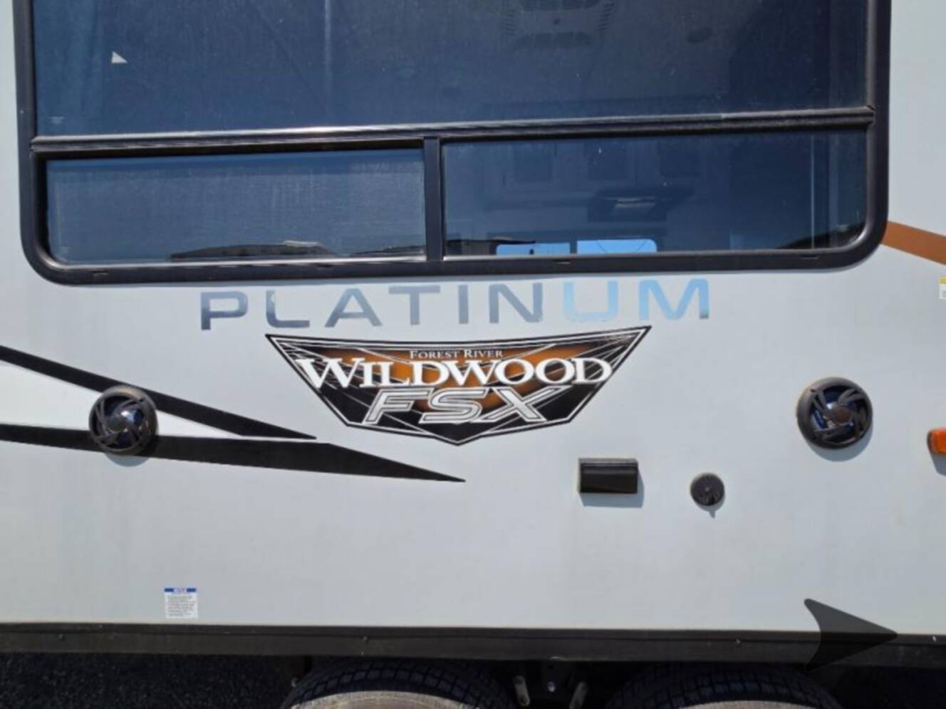 A photo of this 2022 Forest River Rv WILDWOOD FSX PLATINUM 270RTKX