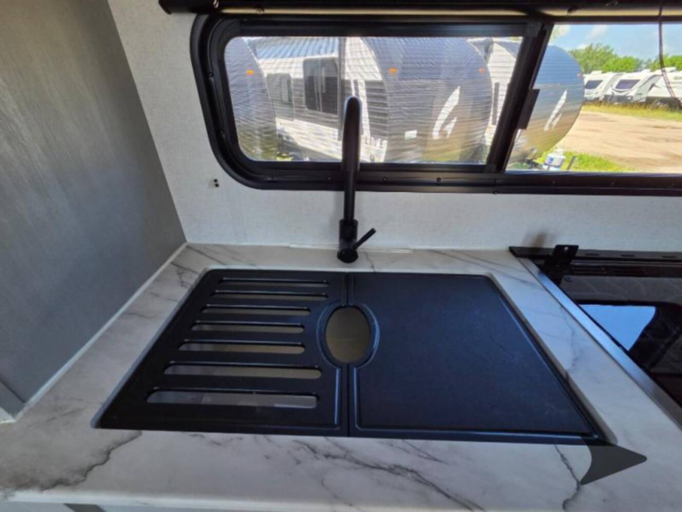 A photo of this 2022 Forest River Rv WILDWOOD FSX PLATINUM 270RTKX