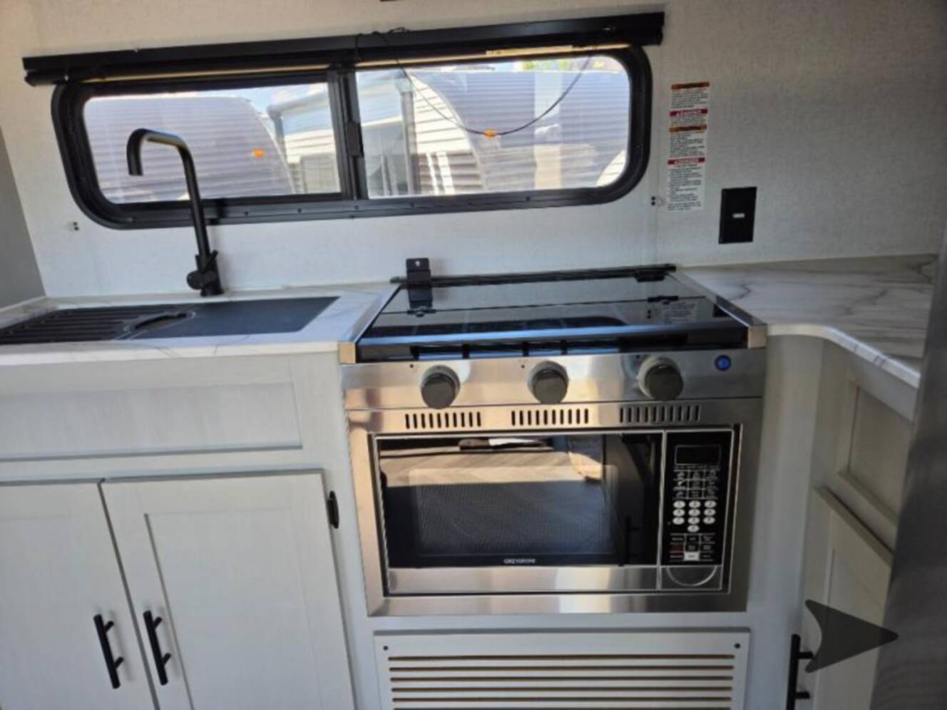 A photo of this 2022 Forest River Rv WILDWOOD FSX PLATINUM 270RTKX