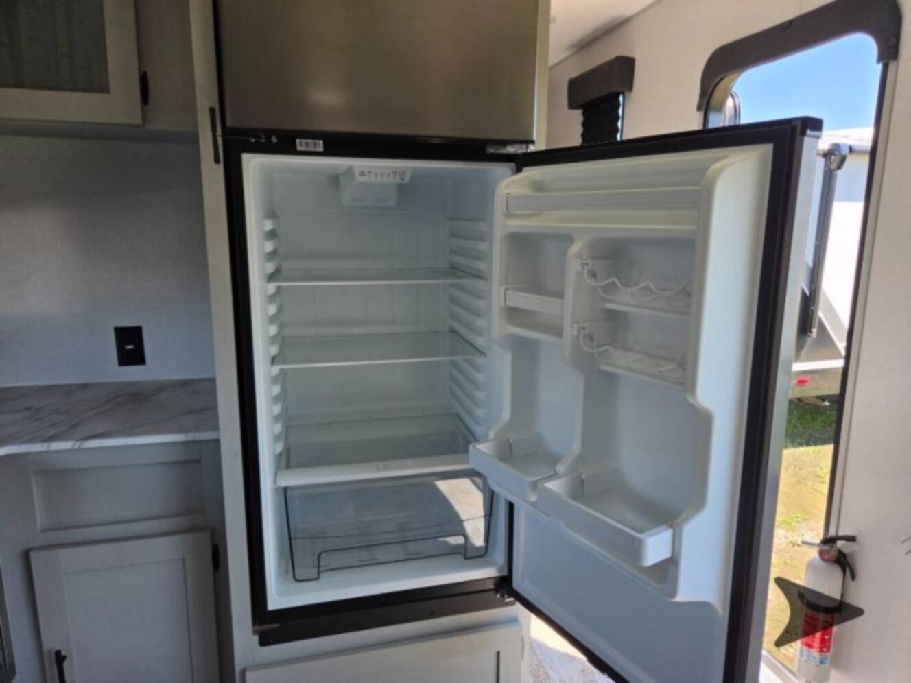 A photo of this 2022 Forest River Rv WILDWOOD FSX PLATINUM 270RTKX