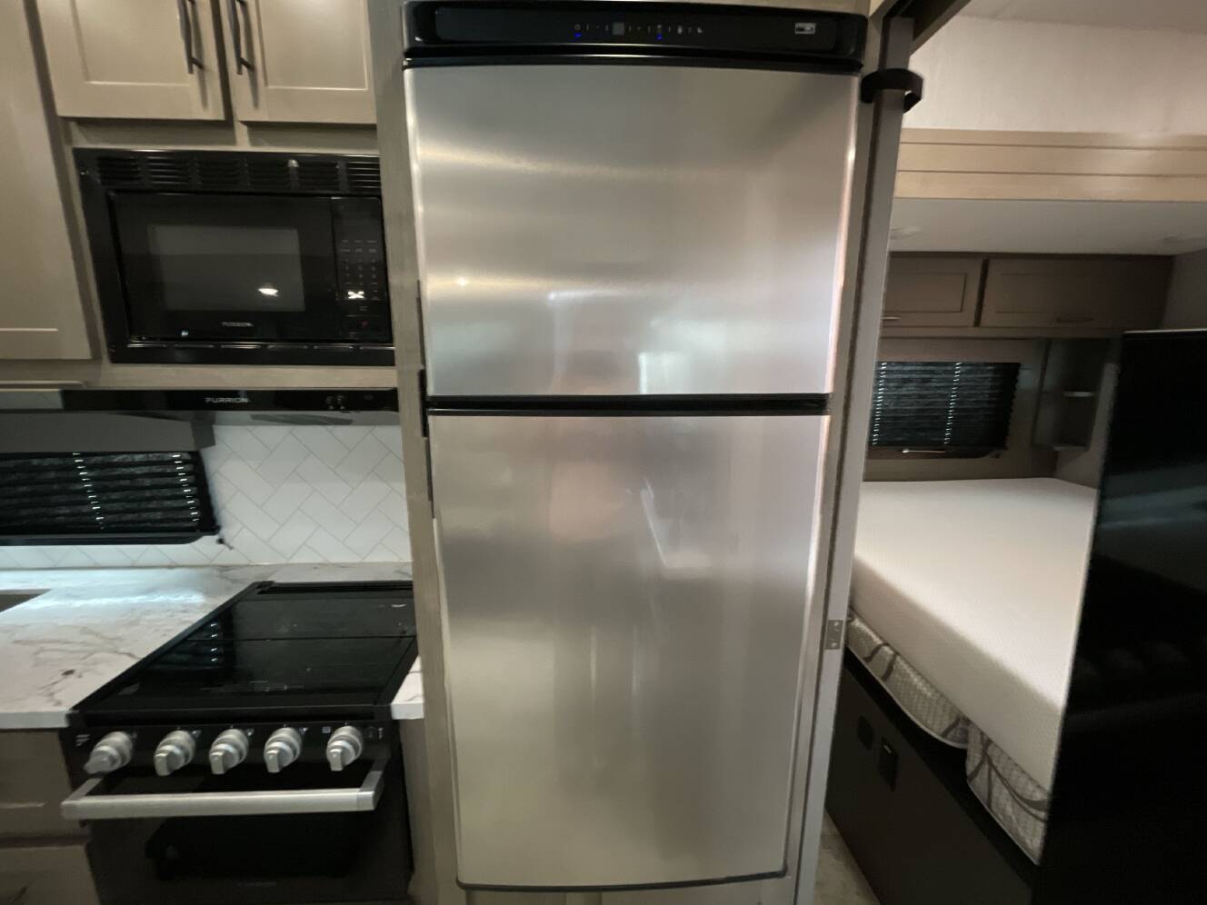 A photo of this 2023 Grand Design MOMENTUM G CLASS 29G