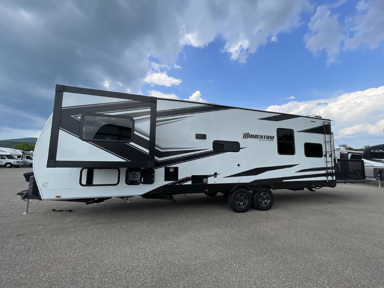 A photo of this 2023 Grand Design MOMENTUM G CLASS 29G