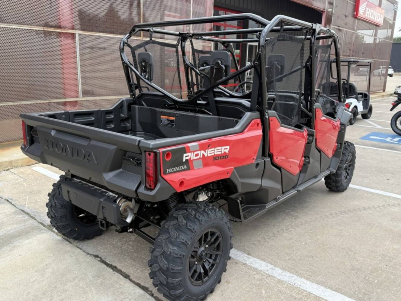 A photo of this 2025 Honda® Pioneer 1000-6 Deluxe Crew
