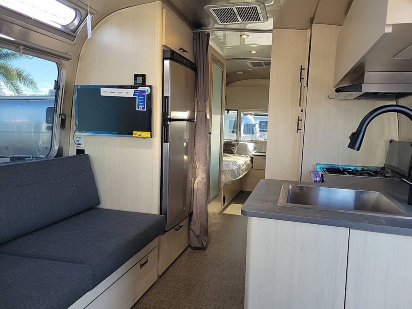 A photo of this 2026 Airstream Flying Cloud ® 25FB Midnight Flamingo