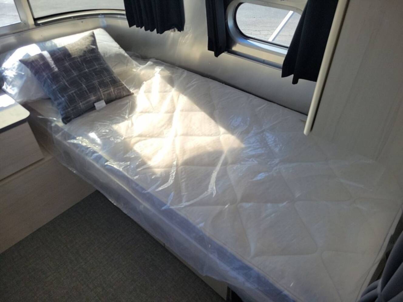 A photo of this 2026 Airstream Flying Cloud ® 25FB Midnight Flamingo