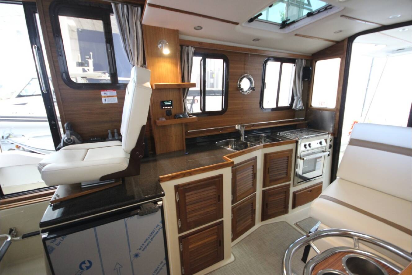 A photo of this 2026 Ranger Tugs R-31 Command Bridge Luxury Edition