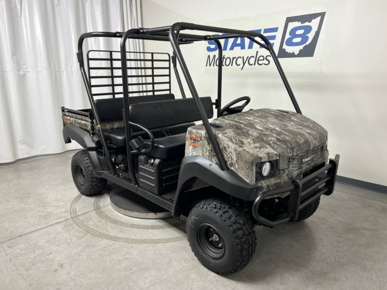 A photo of this 2026 Kawasaki Mule 4010 Trans4x4 Camo (KAT620CTFNN)