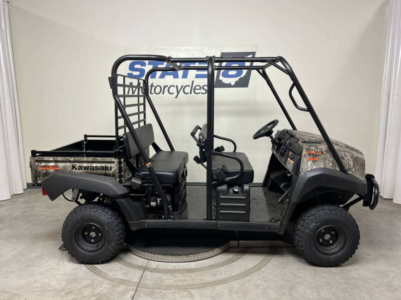 A photo of this 2026 Kawasaki Mule 4010 Trans4x4 Camo (KAT620CTFNN)