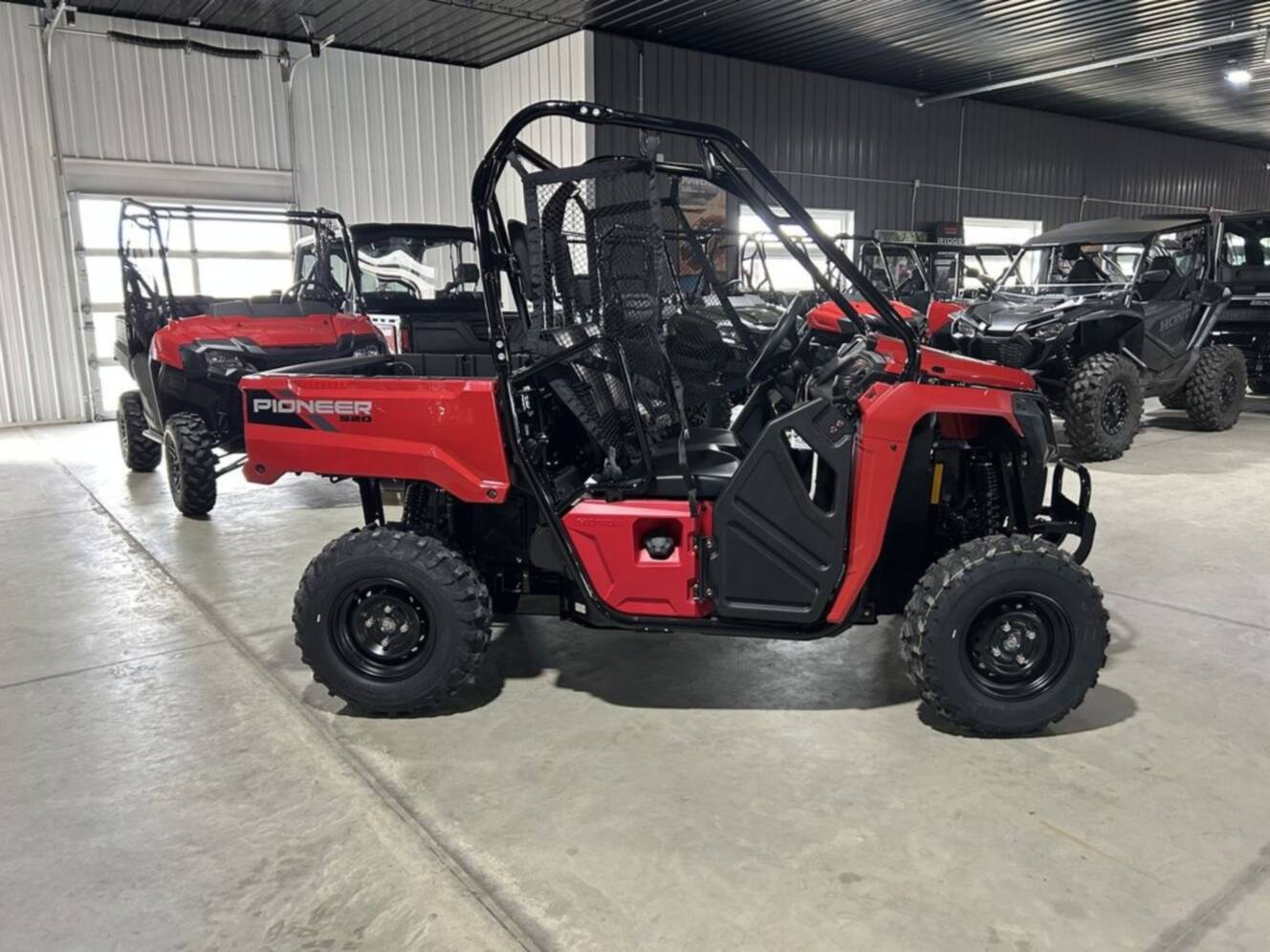 A photo of this 2026 Honda® PIONEER 520 Red