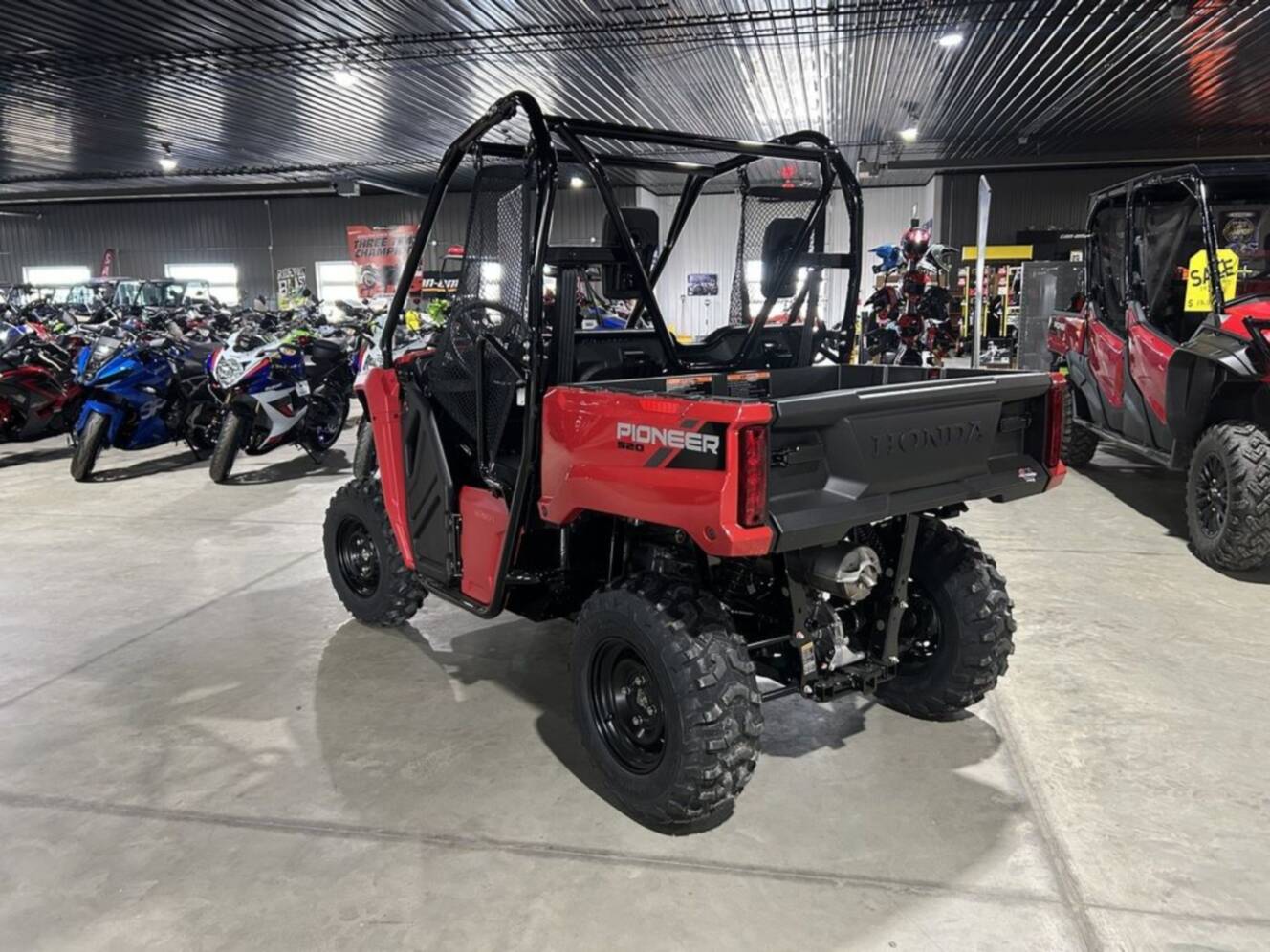 A photo of this 2026 Honda® PIONEER 520 Red