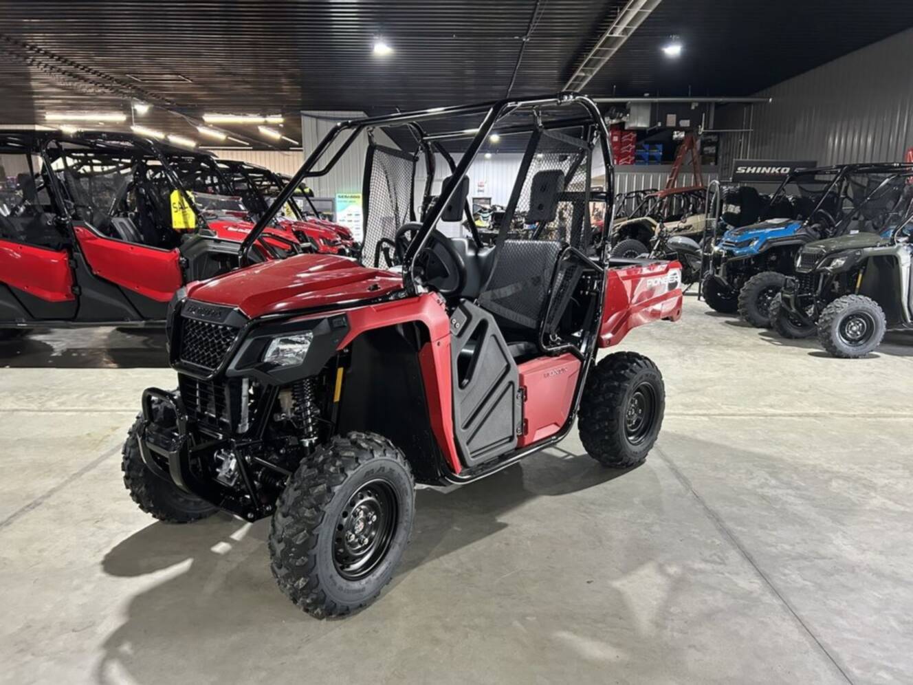 A photo of this 2026 Honda® PIONEER 520 Red