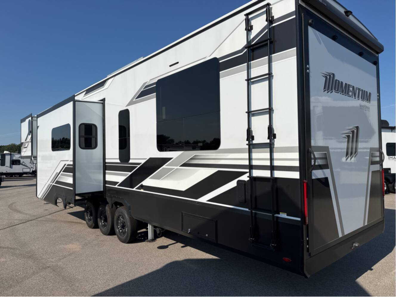 A photo of this 2026 Grand Design MOMENTUM M-CLASS 395MS