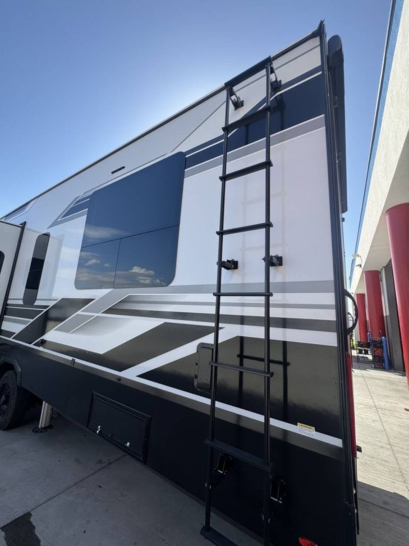 A photo of this 2026 Grand Design MOMENTUM M-CLASS 395MS