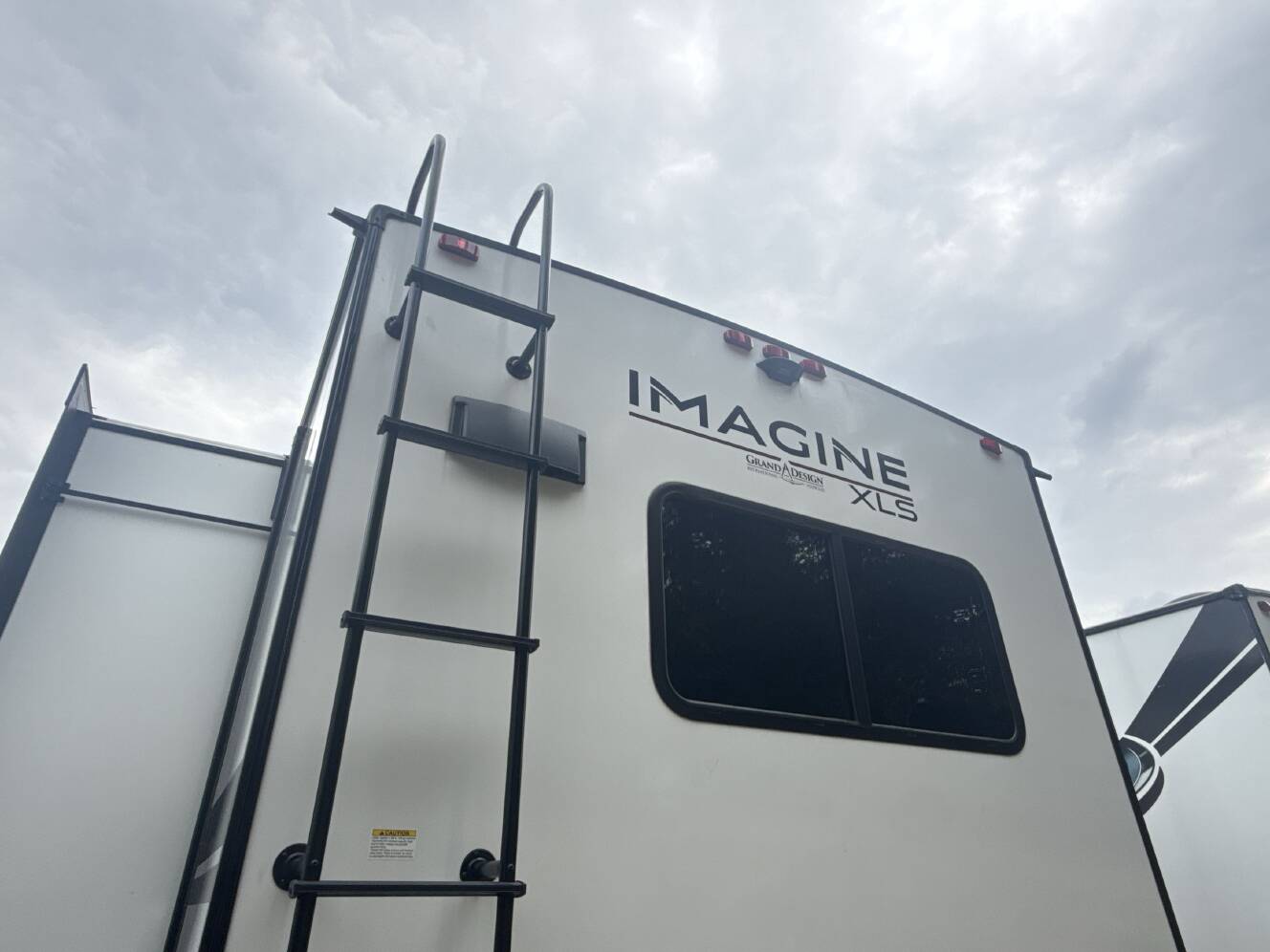A photo of this 2025 Grand Design IMAGINE XLS 23LDE
