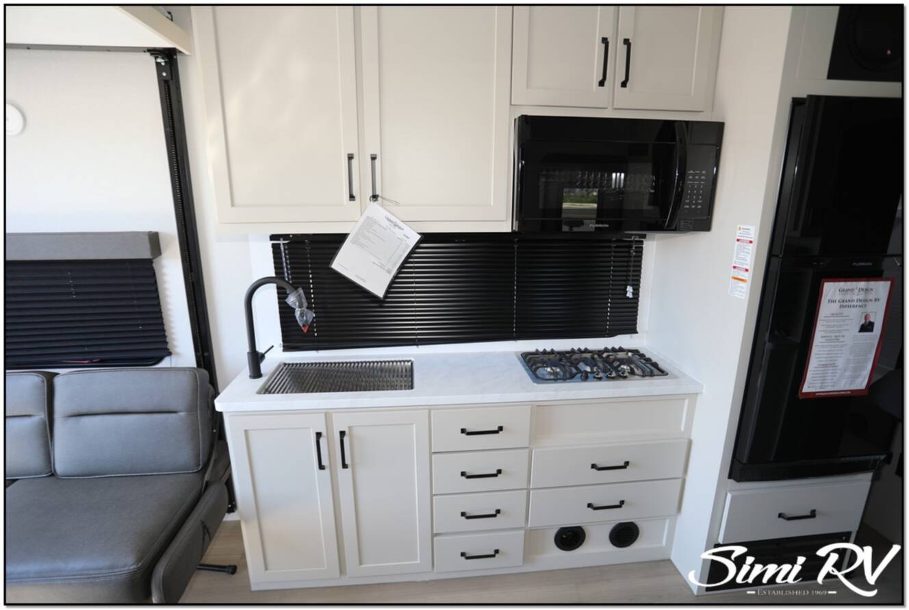 A photo of this 2026 Grand Design Momentum G Class (Travel Trailer) 21G