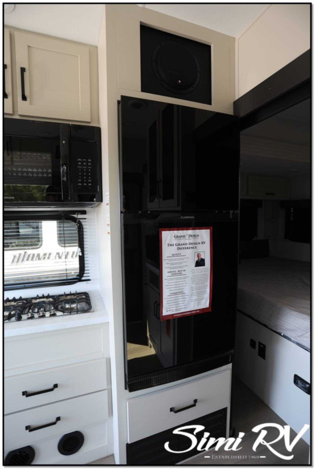 A photo of this 2026 Grand Design Momentum G Class (Travel Trailer) 21G