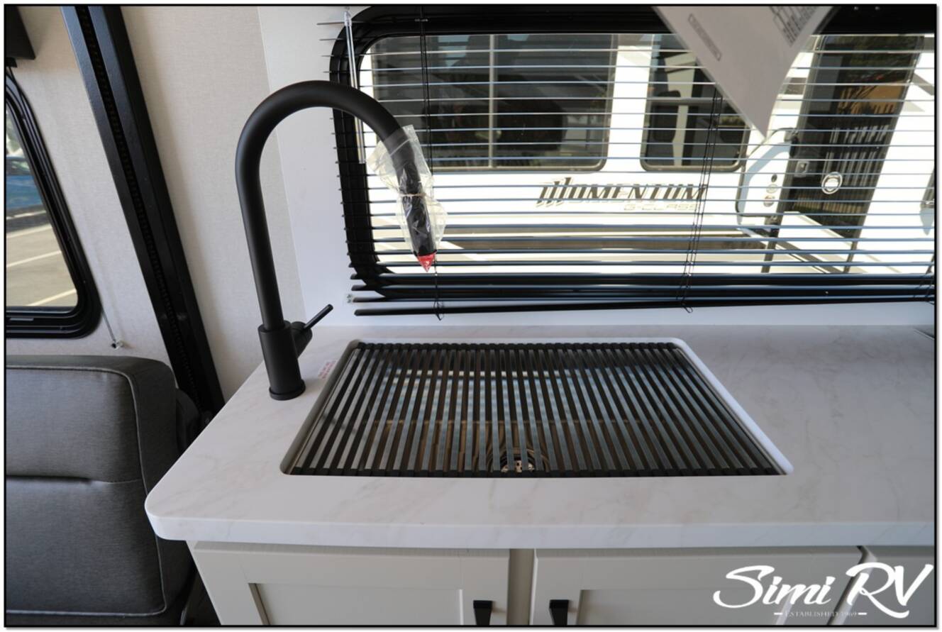 A photo of this 2026 Grand Design Momentum G Class (Travel Trailer) 21G