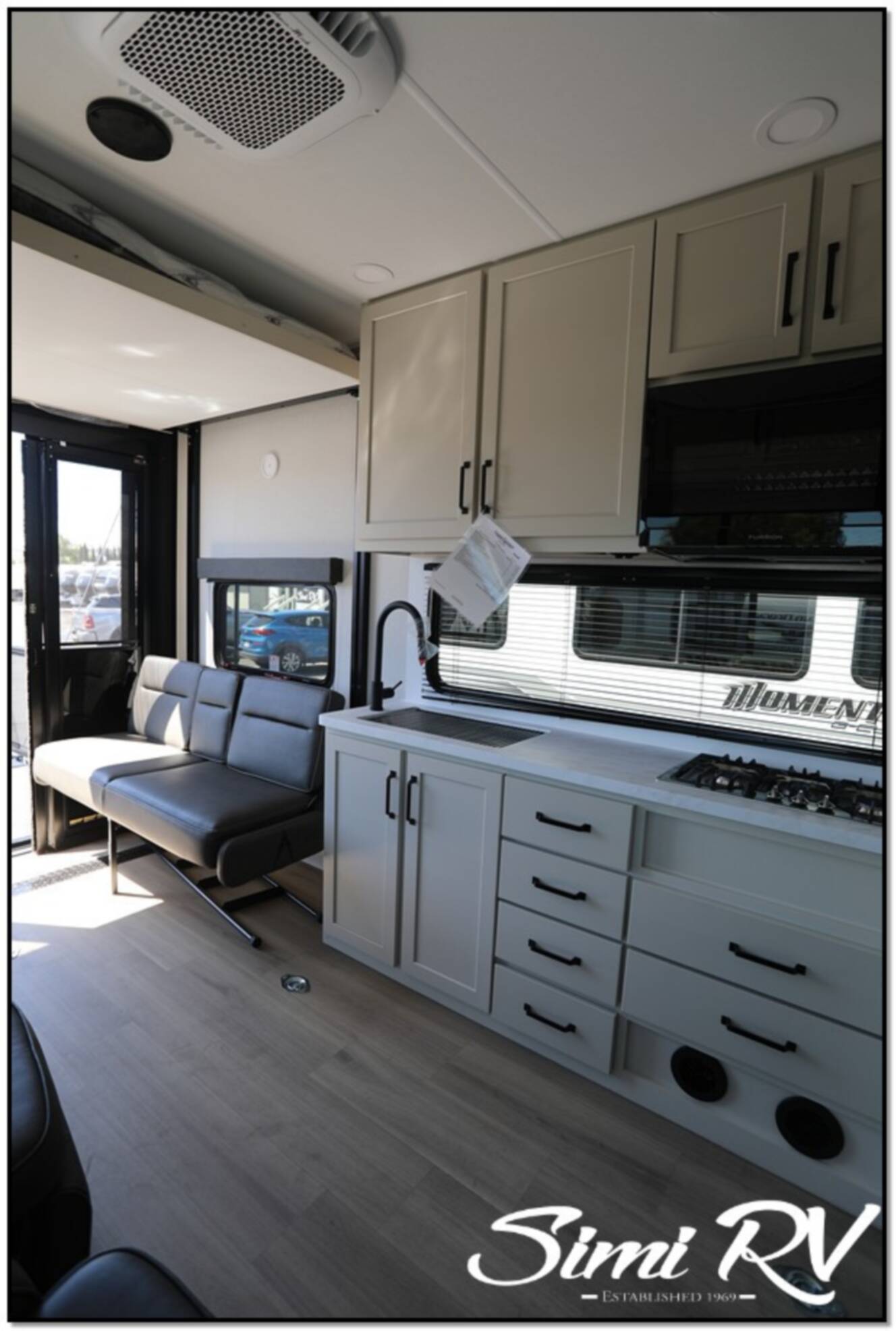 A photo of this 2026 Grand Design Momentum G Class (Travel Trailer) 21G