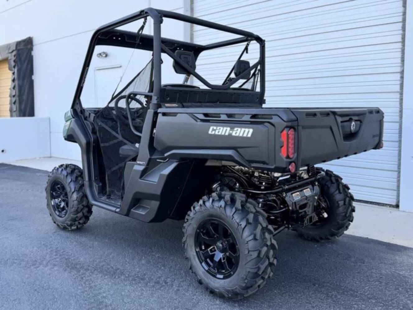 A photo of this 2025 Can-Am Defender DPS HD10 Compass Green