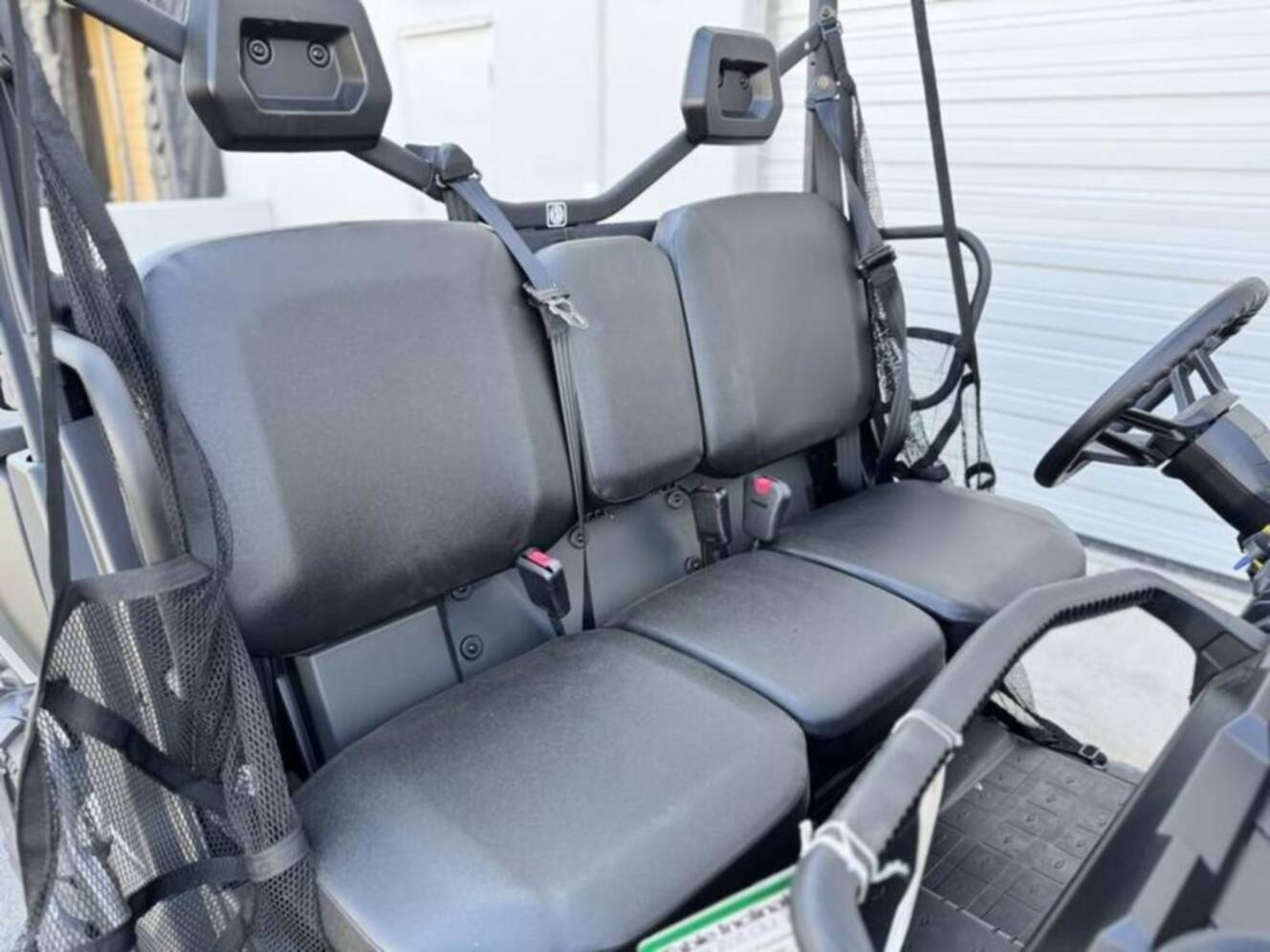 A photo of this 2025 Can-Am Defender DPS HD10 Compass Green