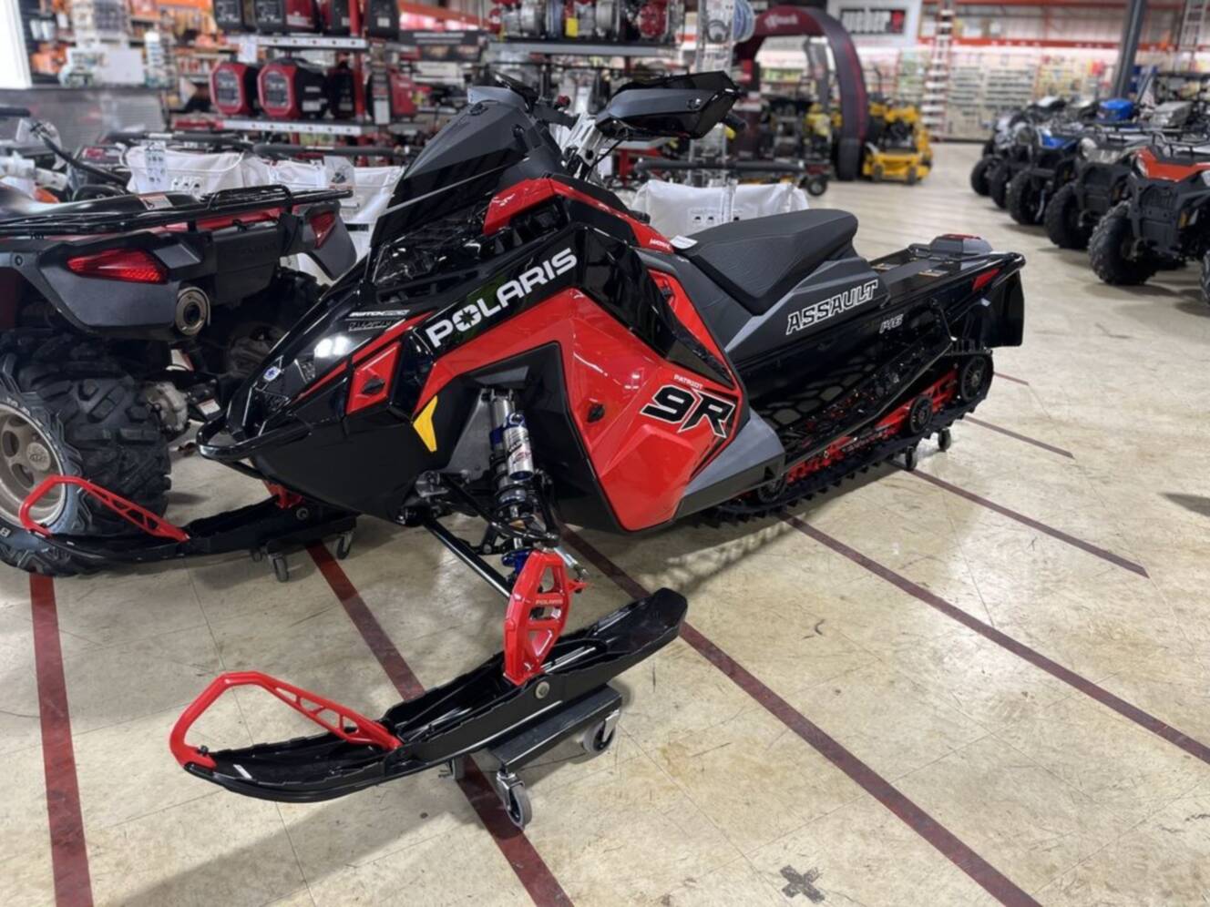 A photo of this 2026 Polaris® Patriot 9R Switchback Assault 146 - Race IFS Indy Red /