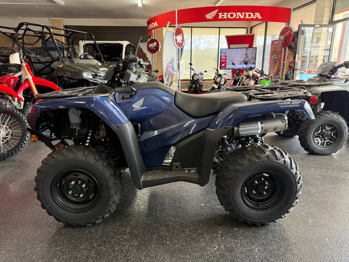 A photo of this 2025 Honda FOURTRAX RANCHER 4x4 AUTO DCT IRS EPS