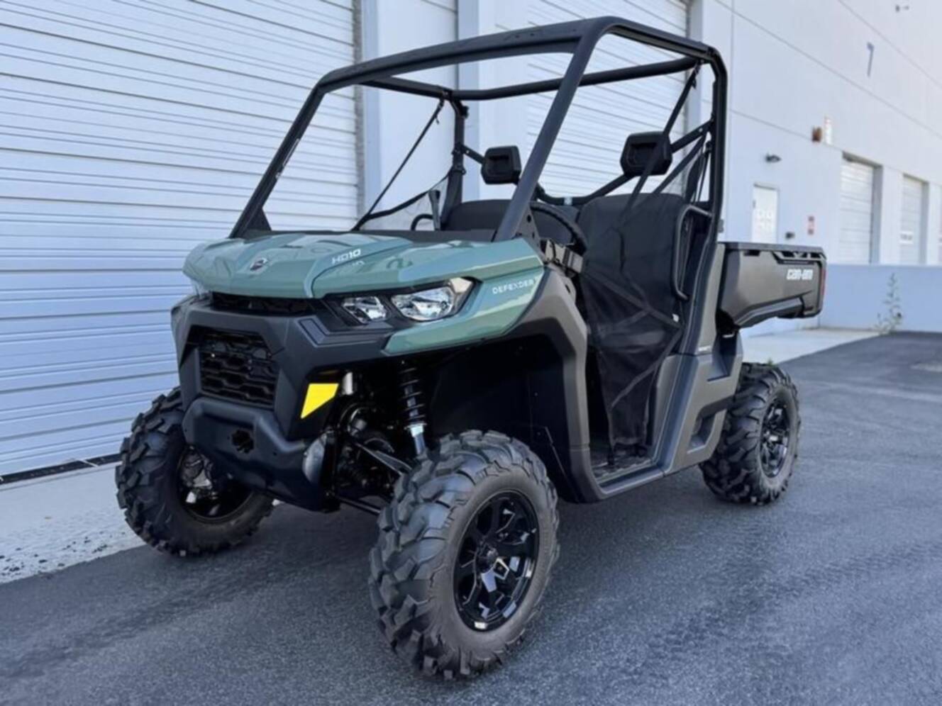 A photo of this 2025 Can-Am Defender DPS HD10 Compass Green