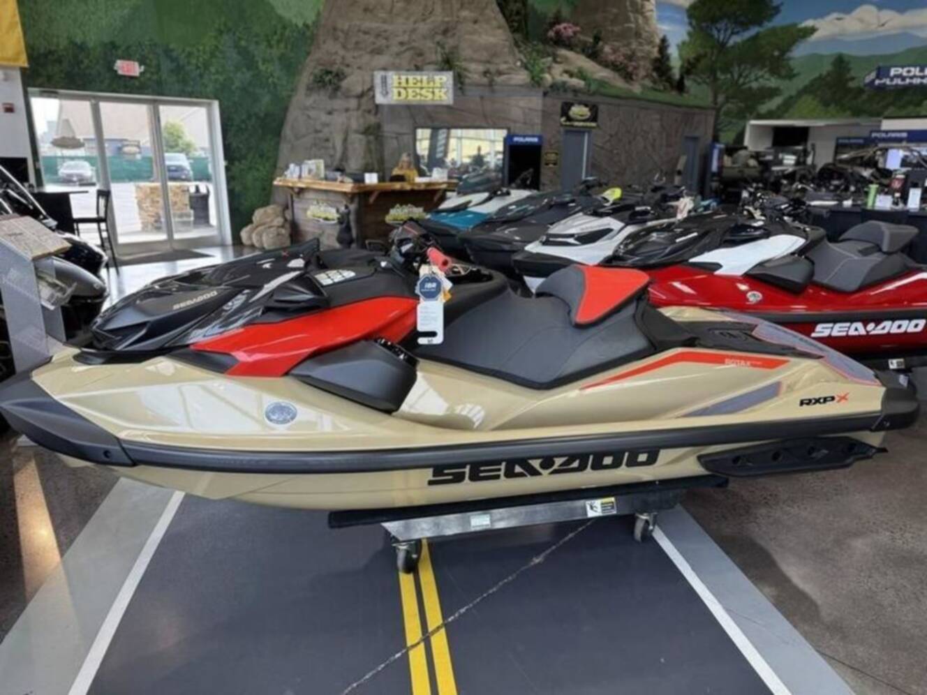 A photo of this 2025 Sea-Doo RXP-X 325 Tech, BRP Premium A, iBR Metallic Tan / La