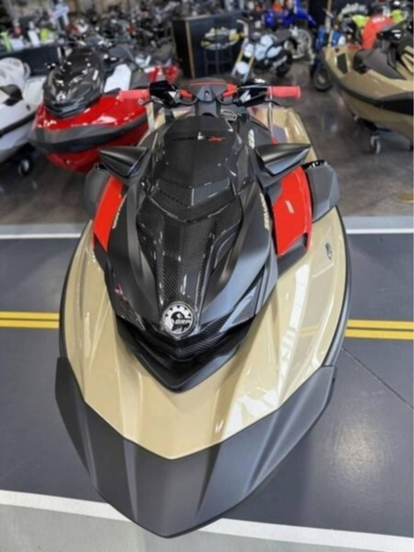 A photo of this 2025 Sea-Doo RXP-X 325 Tech, BRP Premium A, iBR Metallic Tan / La