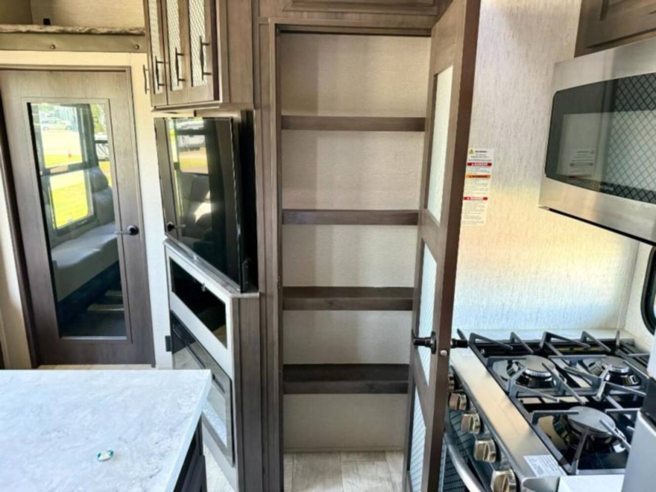 A photo of this 2023 Grand Design Momentum 381MS
