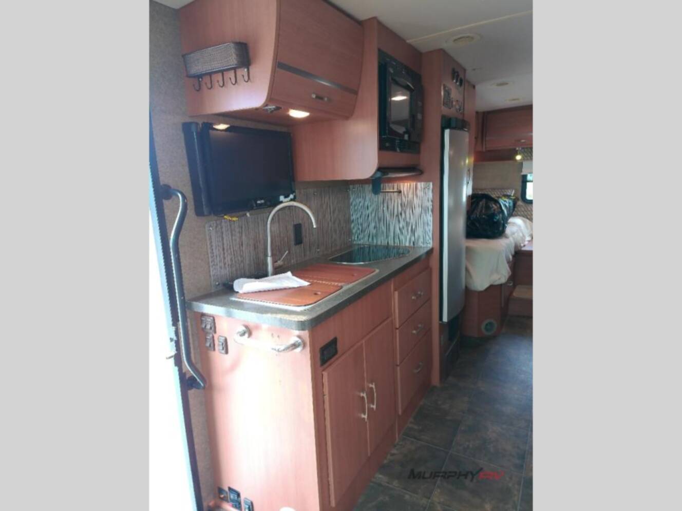 A photo of this 2013 Itasca Navion IQ 24V