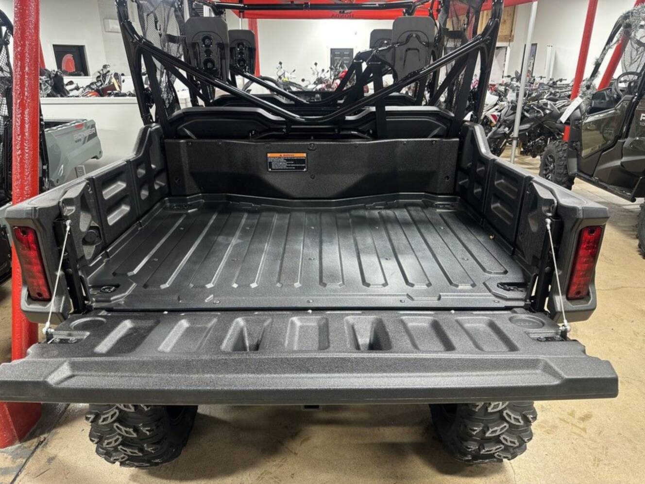A photo of this 2025 Honda® Pioneer 1000-6 Deluxe Crew TrueTimber Atera Camo