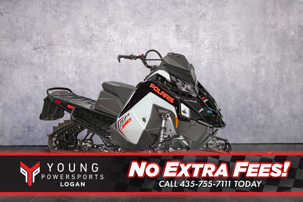 2027 Polaris® 650 RMK SP 155 White Lightning / Gloss Black / Orange B 650 155 in logan UT
