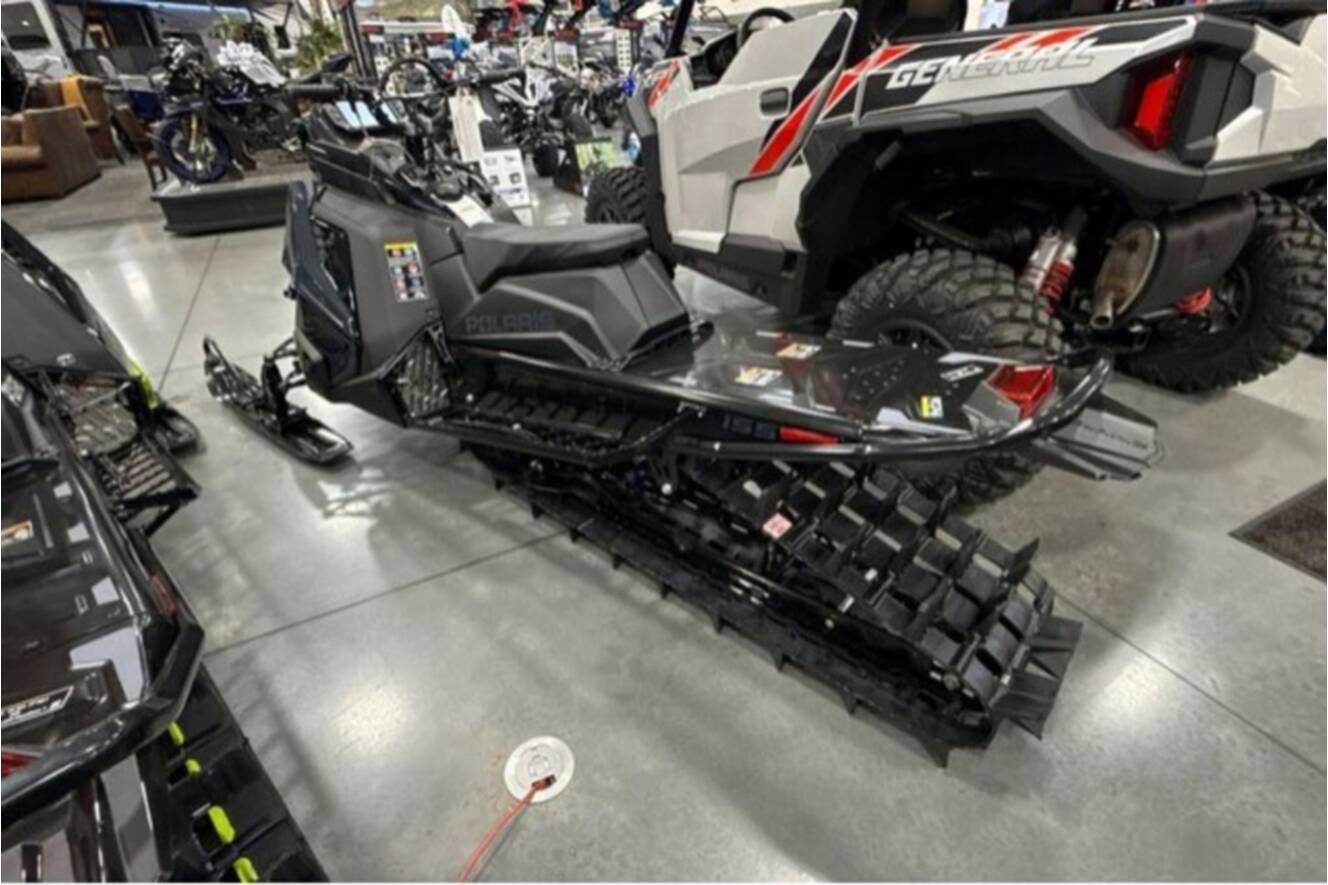 A photo of this 2026 Polaris® SNO-26 BOOST RMK KHAOS 155 Patriot Boost