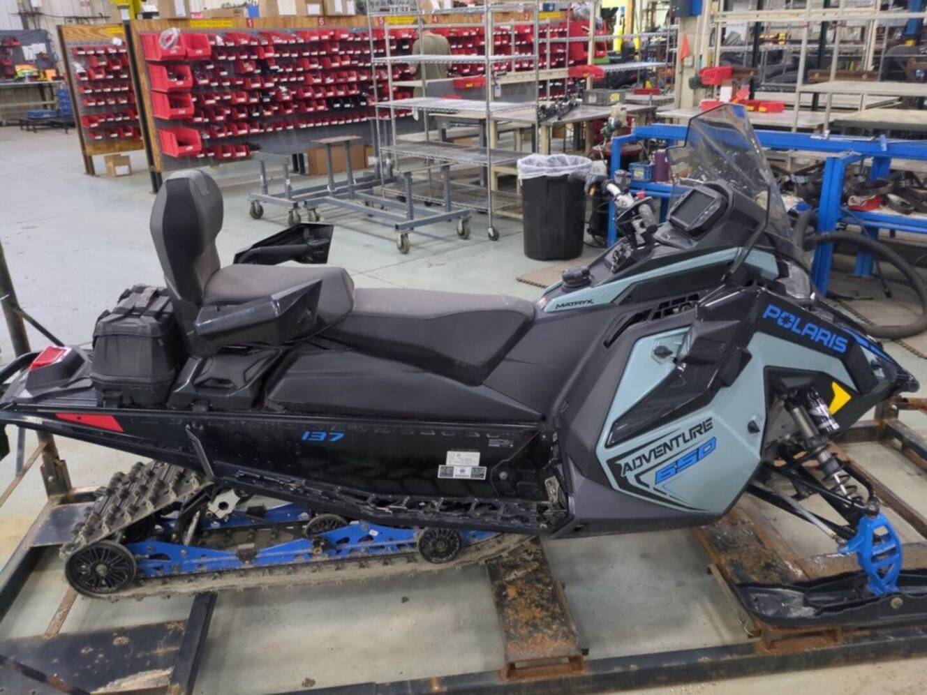 A photo of this 2026 Polaris® 650 INDY Adventure 137 Hemlock Blue / Black / Velocity 