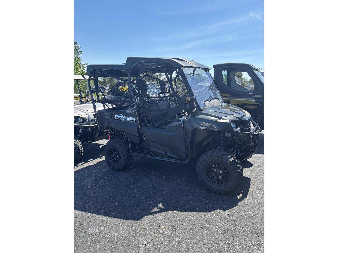 A photo of this 2025 Honda PIONEER 700-4 DELUXE Deluxe