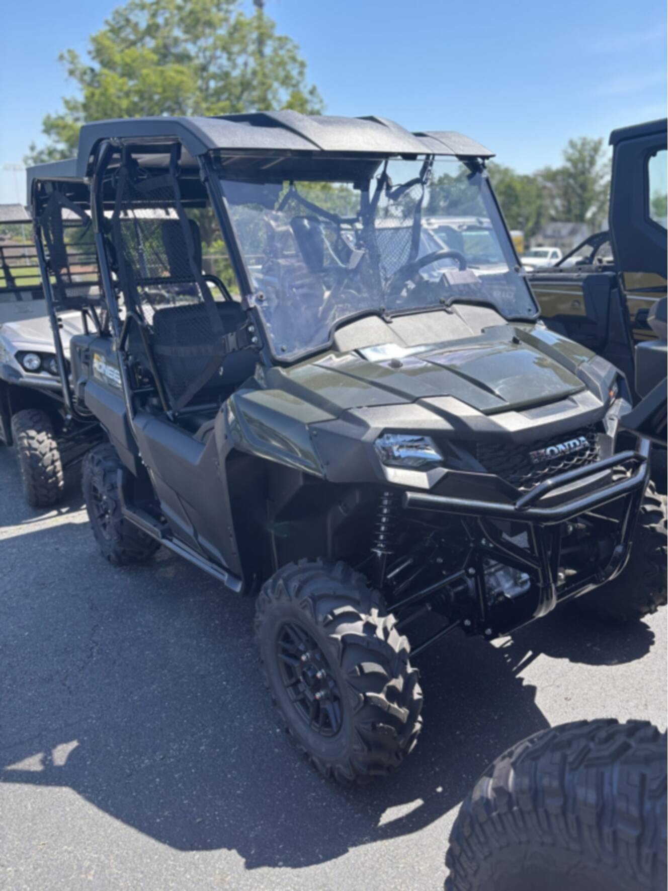 A photo of this 2025 Honda PIONEER 700-4 DELUXE Deluxe