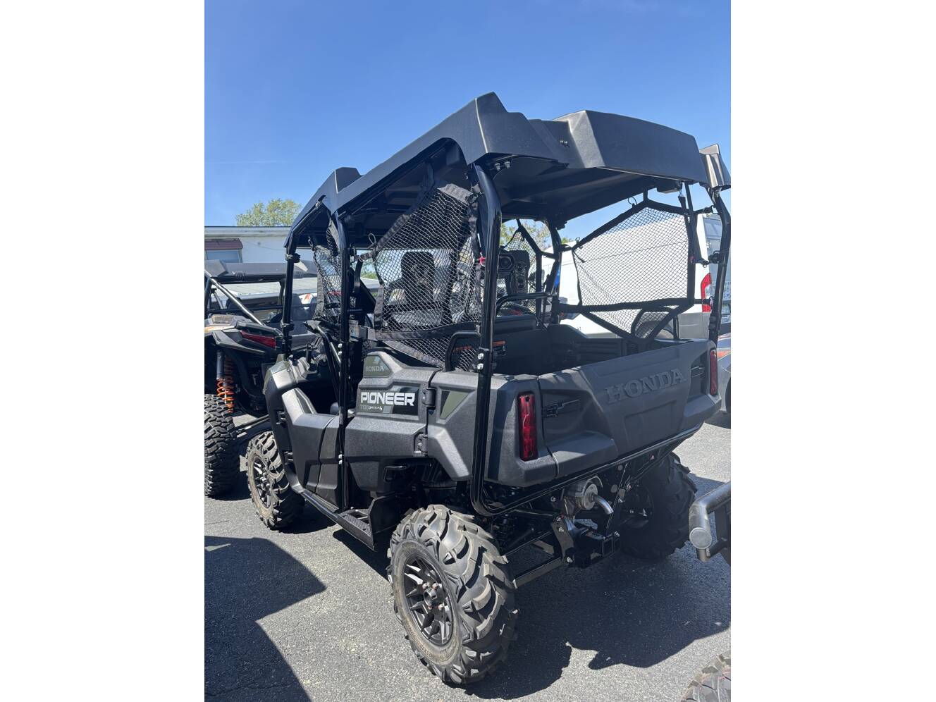 A photo of this 2025 Honda PIONEER 700-4 DELUXE Deluxe