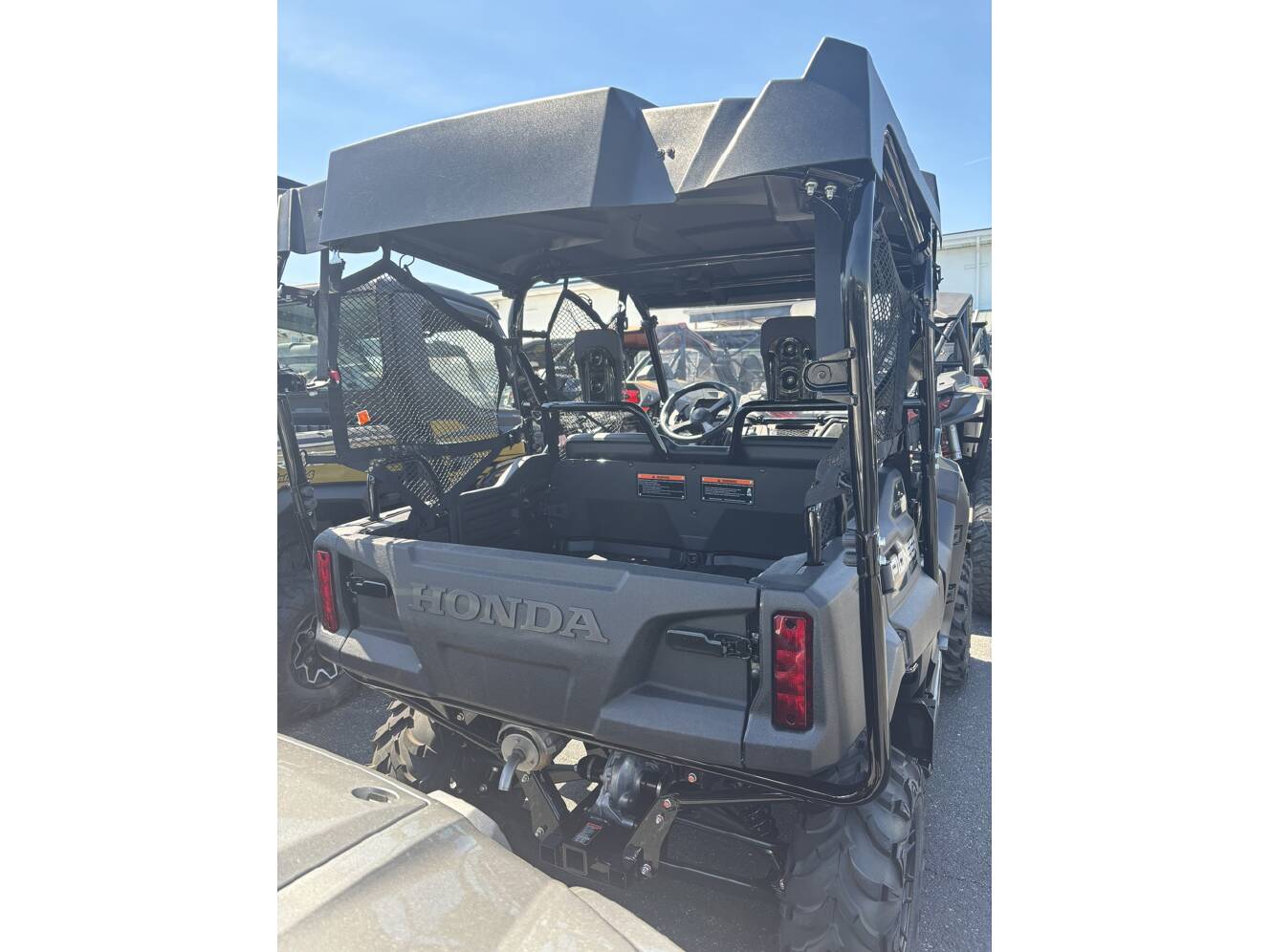 A photo of this 2025 Honda PIONEER 700-4 DELUXE Deluxe