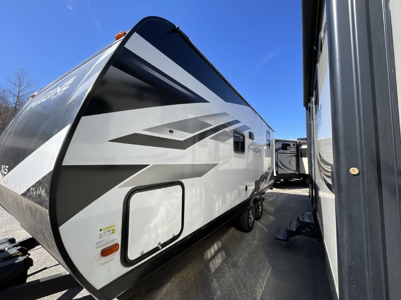 A photo of this 2023 Grand Design IMAGINE XLS 21BHE