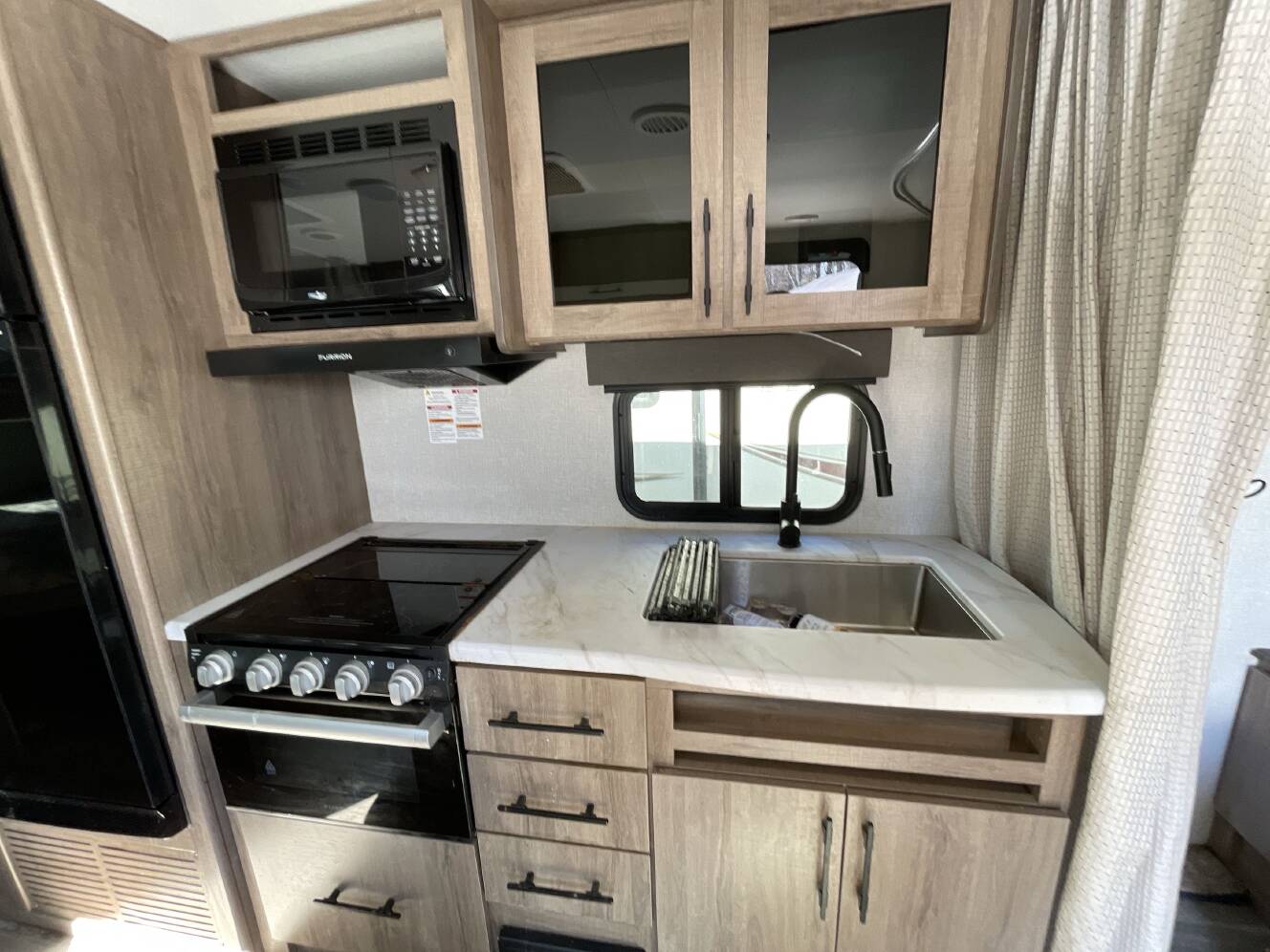 A photo of this 2023 Grand Design IMAGINE XLS 21BHE