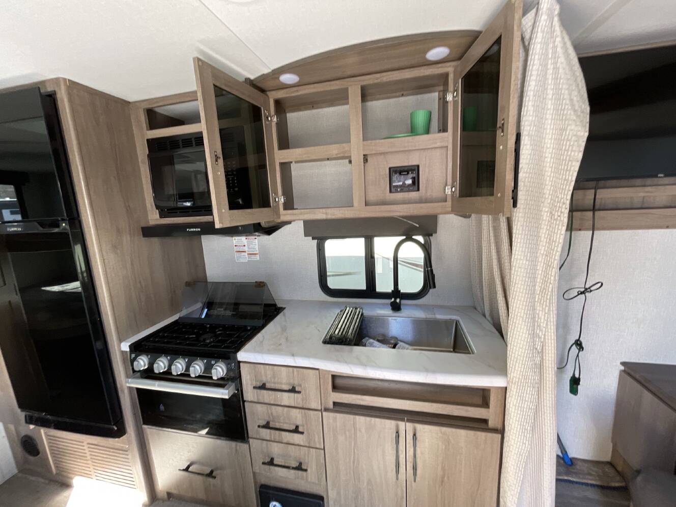 A photo of this 2023 Grand Design IMAGINE XLS 21BHE