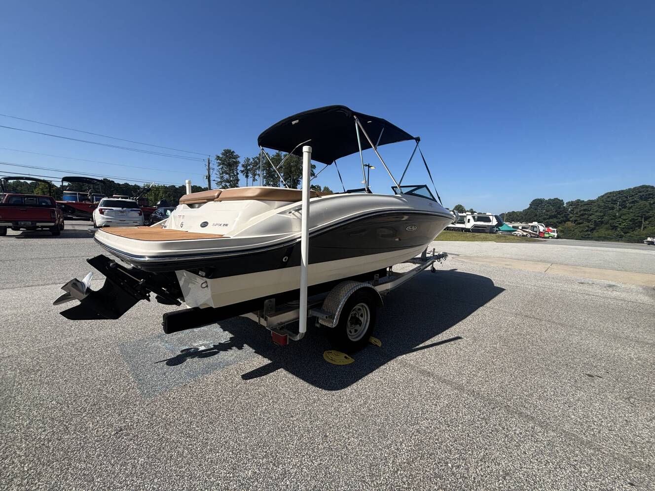 A photo of this 2018 Sea Ray 210 SPX w/MerCruiser 4.5L - 250HP Engine and Trailer