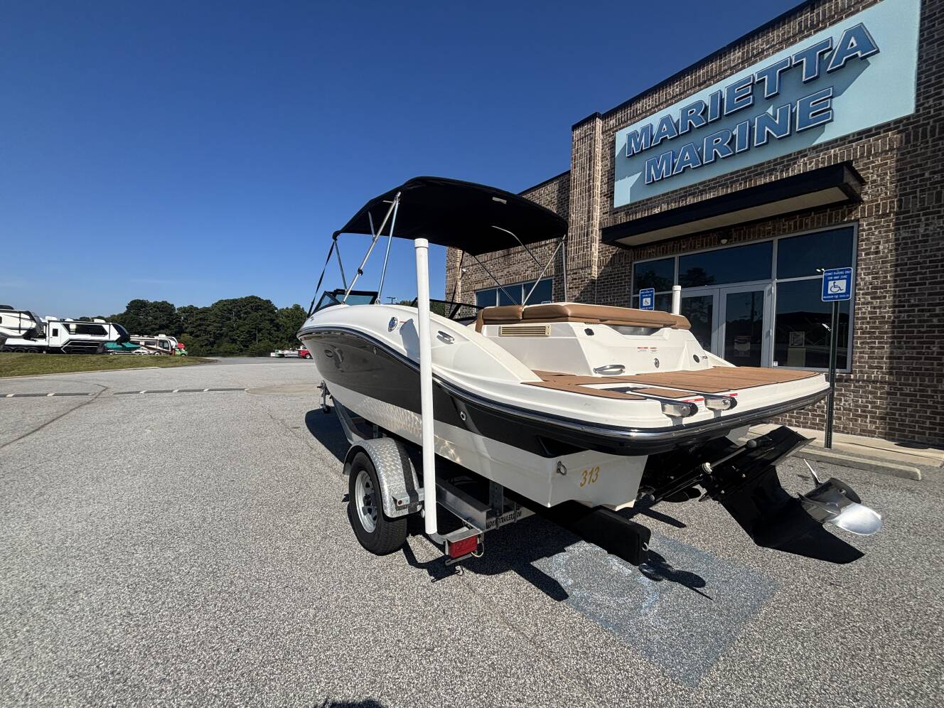 A photo of this 2018 Sea Ray 210 SPX w/MerCruiser 4.5L - 250HP Engine and Trailer