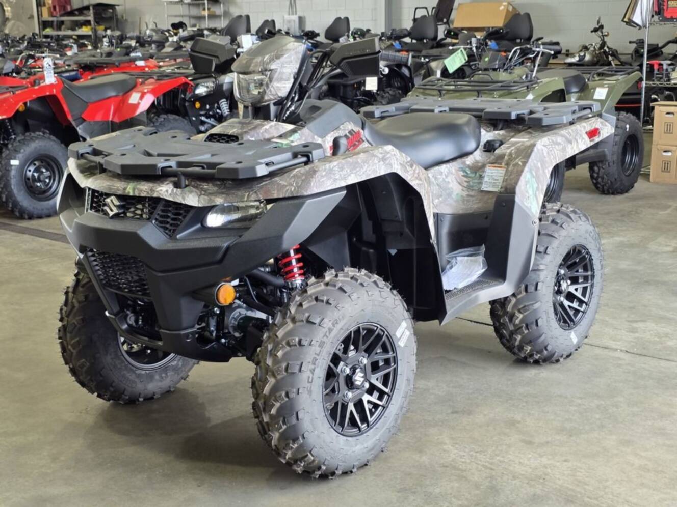 A photo of this 2025 Suzuki KingQuad 500AXi Power Steering SE Camo