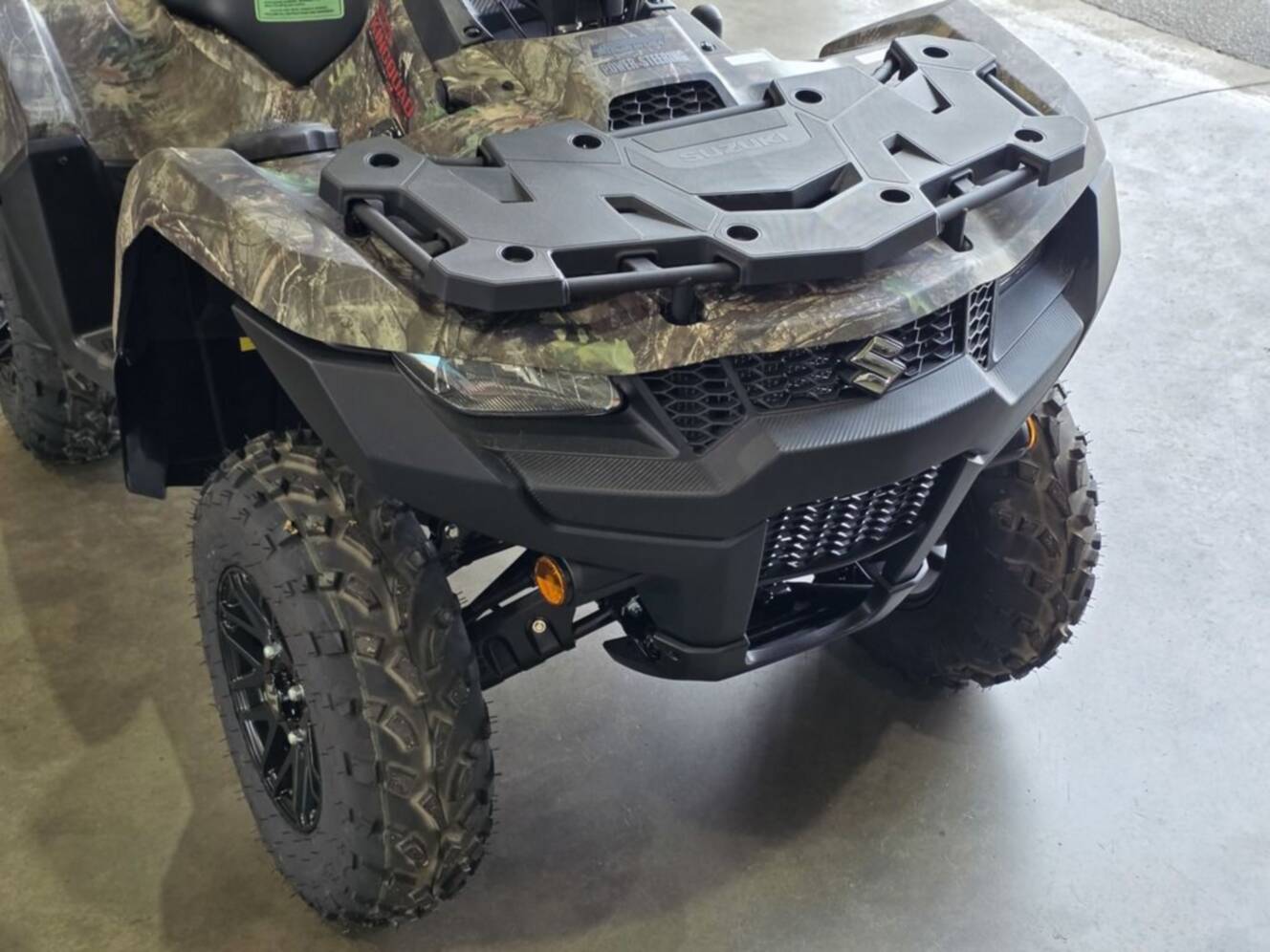A photo of this 2025 Suzuki KingQuad 500AXi Power Steering SE Camo
