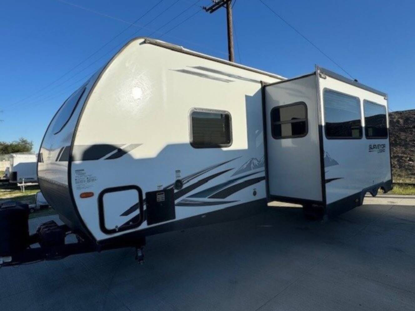 A photo of this 2022 Forest River SURVEYOR LEGEND 276BHLE