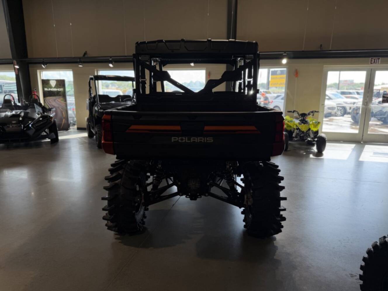 A photo of this 2026 Polaris RGR CREW XP 1000 PREMIUM ORANGE RUST