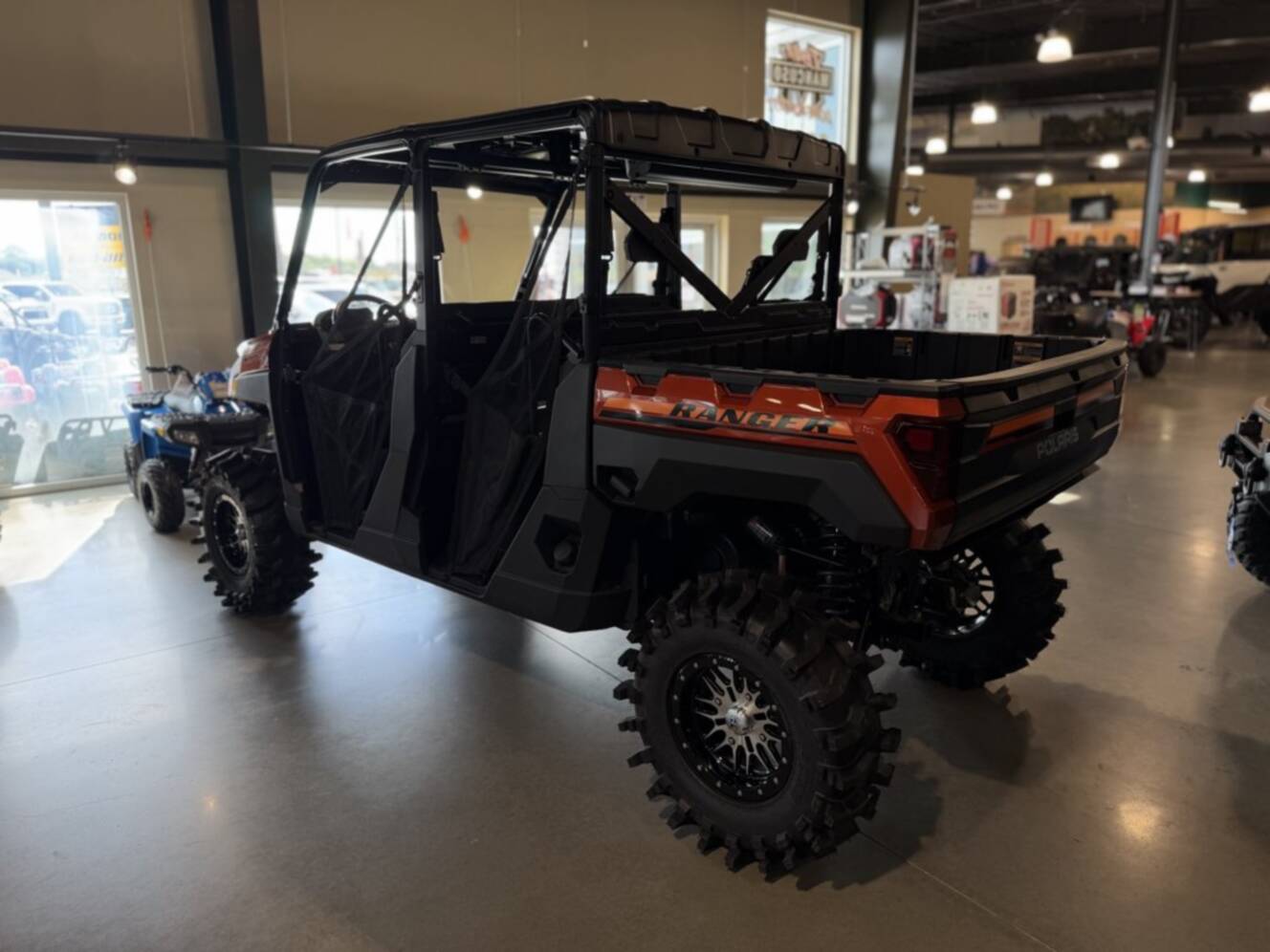 A photo of this 2026 Polaris RGR CREW XP 1000 PREMIUM ORANGE RUST