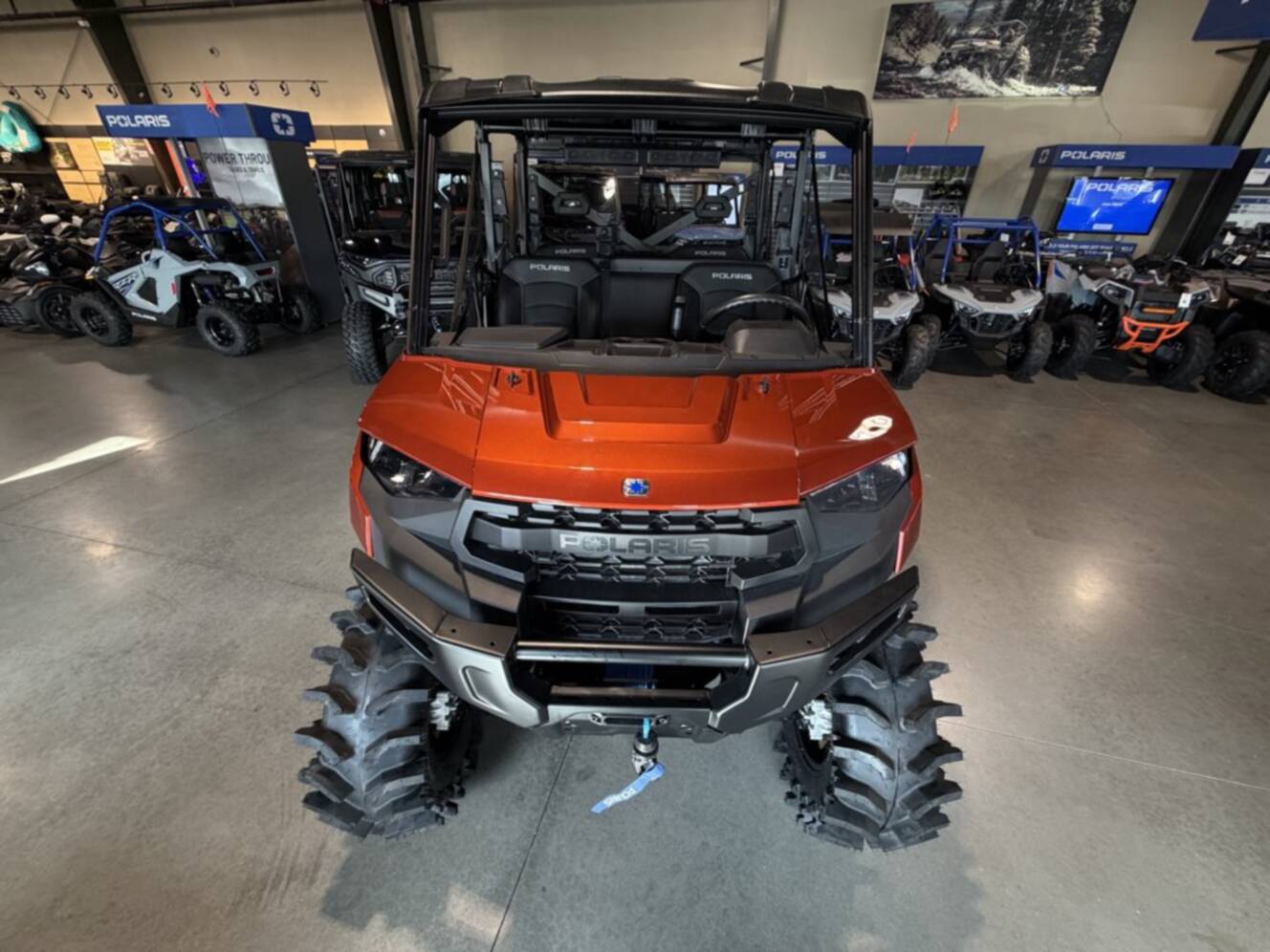 A photo of this 2026 Polaris RGR CREW XP 1000 PREMIUM ORANGE RUST